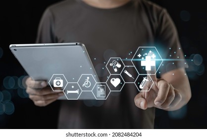 Man Pointing With Medical Icons Using Tablet. Analysis Technology Equipment Medicine Healthy, Business And Healthcare Concept.