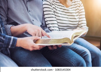  A Man Pointing On Blurred Page Of Bible While Study Bible With Friends In Sunday School Class 