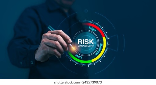 A man is pointing at a risk management level on a screen, strategic control and assessment of risks, analysis aimed at achieving high performance and financial success - Powered by Shutterstock