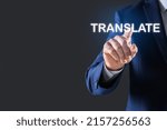 Man pointing at virtual model of word TRANSLATE against grey background, closeup. Space for text