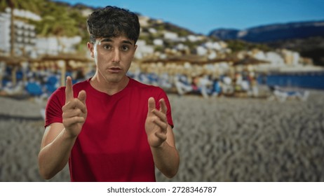 Man points finger at camera in a studio with beach backdrop and sand umbrellas; determination resolve.
