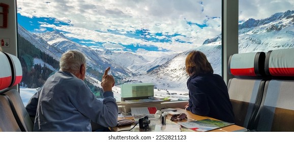 Man Points At Swiss Alps From The Glacier Express - Shutterstock ID 2252821123