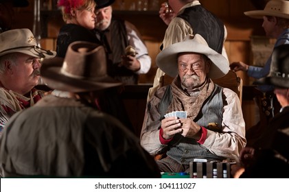 Man With Poker Face In American Old West Scene