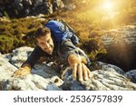 Man, portrait and climbing on mountain outdoor of fitness adventure, sport challenge and hiking. Male person, backpack and rocks support with trekking, balance and exercise activity of nature explore