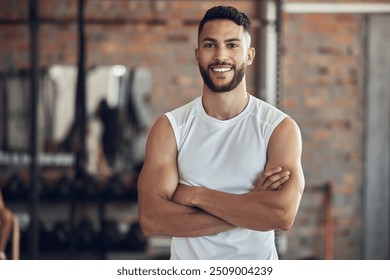 Man, portrait and confident in gym for exercise or daily workout routine, muscle growth and development. Male person, arms crossed and happy with pride in studio for fitness, cardio and training. - Powered by Shutterstock