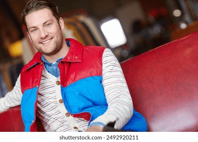 Man, portrait and happy for bomber jacket with bright color, confidence and retail shopping. Customer, smile and vintage puffer for fashion with designer boutique, buy clothes and style inspiration - Powered by Shutterstock