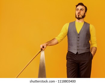 Man Portrait Holding His Musical Saw And Looking Up