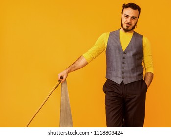 Man Portrait Holding His Musical Saw And Smiling