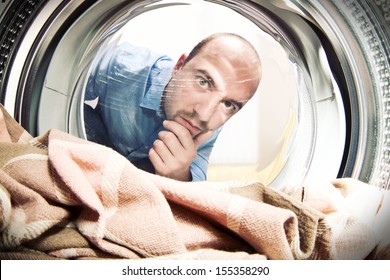 man portrait from inside of washing machine