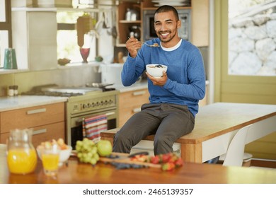 Man, portrait and kitchen with oats for healthy food, diet or nutrition for morning breakfast. Male person, fruit and muesli in home or eating granola for wellness, hungry vegan with happiness - Powered by Shutterstock