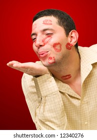 Man Portrait With Many Kisses On His Face