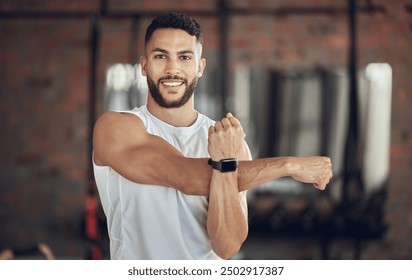 Man, portrait and stretching arm in gym for warm up, daily workout routine and fitness for muscle development. Male person, happy and flexing for physical cardio, training or exercise for health. - Powered by Shutterstock