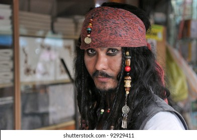 A man poses as Jack Sparrow from Pirates of the Caribbean movie franchise at an informal cosplay meet at Chatuchak Weekend Market on September 11, 2011 in Bangkok, Thailand. 
