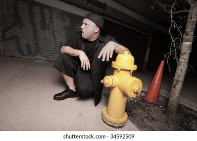 Man posing by a fire hydrant
