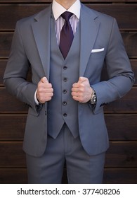 Man Posing In Grey Suit