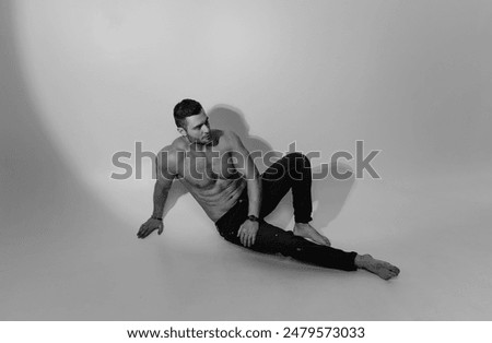 Similar – Image, Stock Photo Black shirtless man sitting with basketball