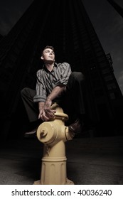 Man posing on a fire hydrant