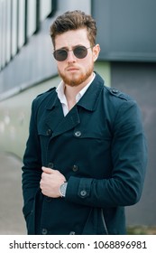 Man posing while wearing sunglasses