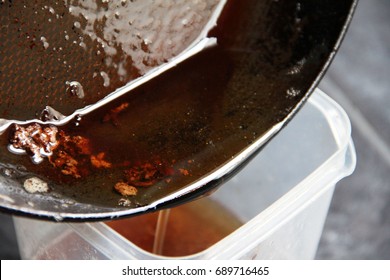 Man Pour Used Cooking Oil Into Plastic Container..Contaminant Cooking Oil,old Oil Or Used Cooking Oil Can Be Reused For Bio-diesel But Not   To Reused For Cook.It May Cause Of Carcinogenic,cancer.  