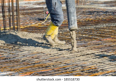 Man pouring concrete directing the pump 