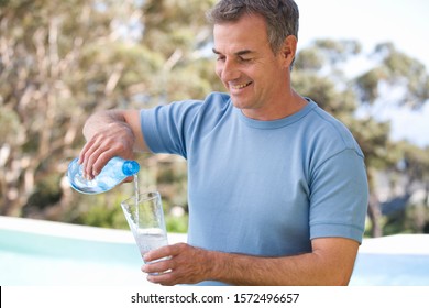 Man Pouring A Glass Of Water