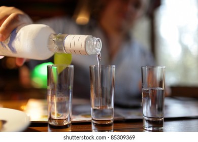 The Man Pouring Vodka In The Restaurant