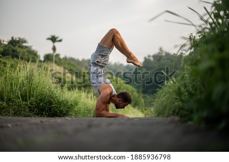Man practice Yoga practice and meditation outdoor.