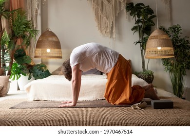 Man Practices Yoga Asana Marjariasana Or Cow Pose Or Cat Cow Pose For Spine