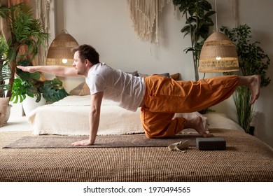 Man Practices Yoga Asana Marjariasana Or Cow Pose Or Cat Cow Pose For Spine