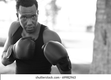 Man practicing boxing in the park - Powered by Shutterstock