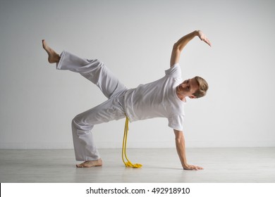 Man practicing capoeira , brazilian martial art.
