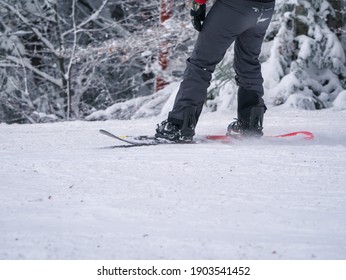 Man Practicing Snowboard On The Ski Slope. Close Up