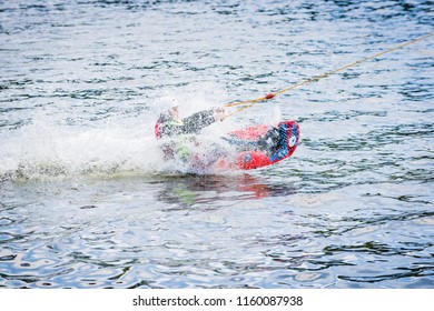 The Man Is Practicing The Start Of The Surfboard Slide On The Water Ski Lift On Lake Trzesiecko In Szczecinek. 