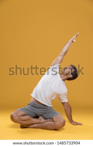 Similar – Mexican yoga teacher practicing side angle pose