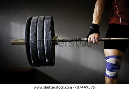 Man practising weightlifting I