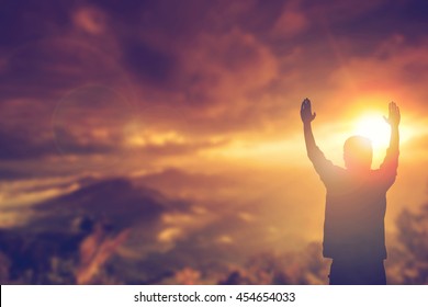 Man Prayer Worship God With Hands Rise Up On Nature. Reborn Christian Praise Holy Spirit On Good Friday, Easter Day With Hope In  Bible  One Muslim Man Motivation Retreet On Weekend Beach