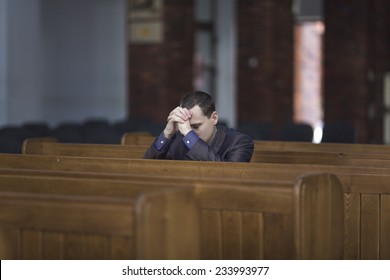 Man Praying In Church