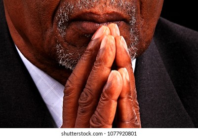 Man Praying In Church With Black Background Stock Photo