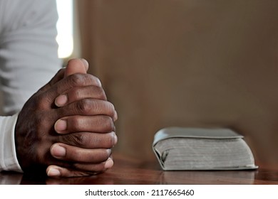 Man Praying To God With Hands Together Stock Photo