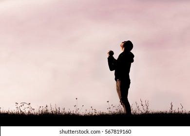 Man praying outside