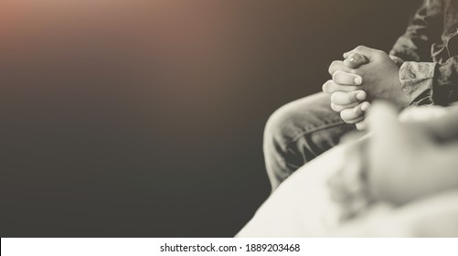 man praying worship at home on black background.Teenager hand praying,Hands folded in prayer.Good friday, Easter, forgiveness.Concept for faith, people, fasting and religion.stay home, lockdown. - Shutterstock ID 1889203468