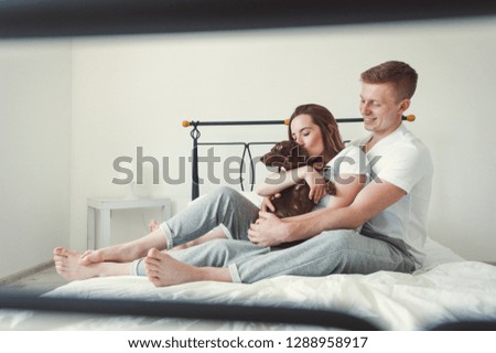 Similar – Image, Stock Photo Man and pregnant woman looking baby clothes