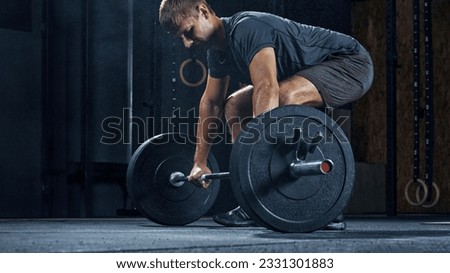 Man prepare lifting barbell at gym. Copy free space.