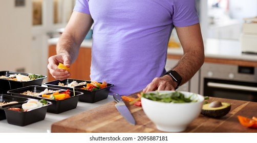 Man Preparing Batch Of Healthy Meals At Home In Kitchen - Shutterstock ID 2095887181