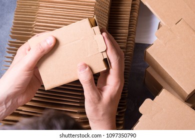 Man Preparing Carton Boxes