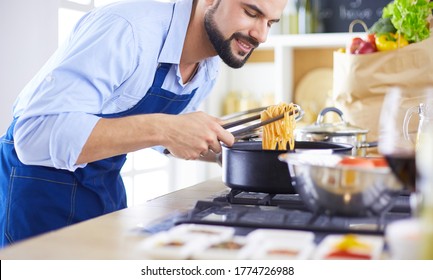 Man preparing delicious and healthy food in the home kitchen - Shutterstock ID 1774726988