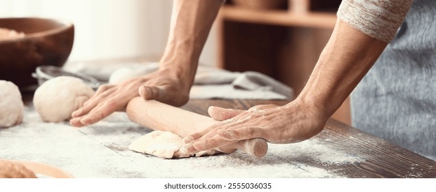 Man preparing dough for bread in kitchen