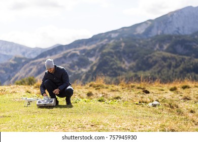 Man preparing drone for flight