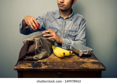 Man Preparing His Lunch At Old Desk