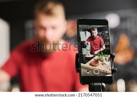 Man Preparing Meal On Camera